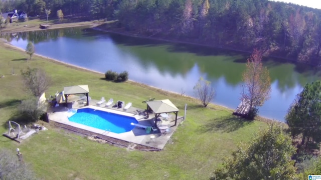 exterior space with a gazebo, a water view, and a lawn