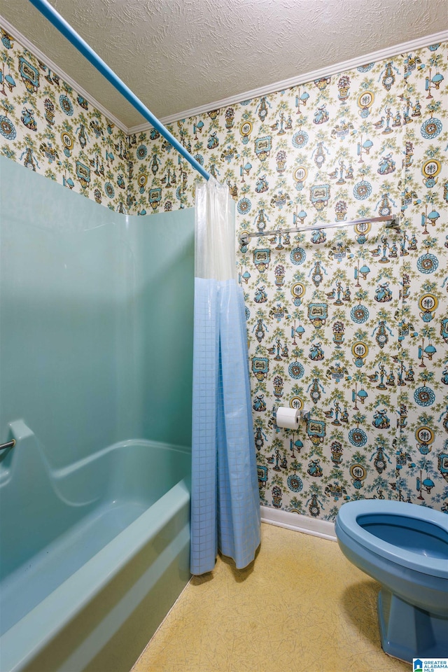 bathroom featuring shower / bath combination with curtain, a textured ceiling, and toilet