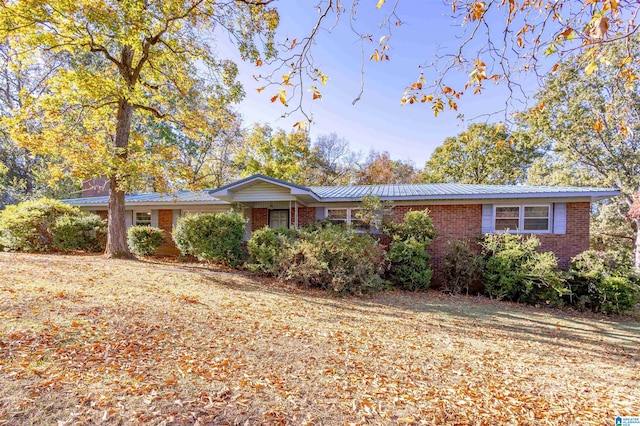 ranch-style house with a front yard