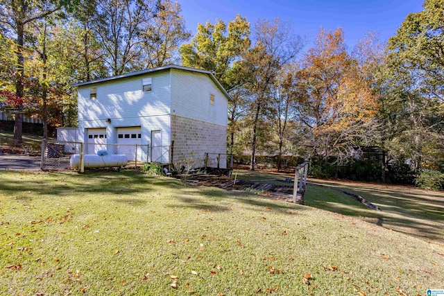 exterior space with a lawn and a garage