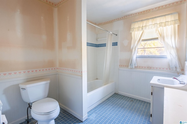 full bathroom with tile patterned floors, shower / tub combo with curtain, vanity, and toilet