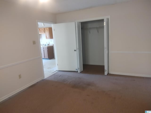 694 Center Point Rd, Sylacauga, AL 35151 - unfurnished bedroom with carpet, a closet, and baseboards