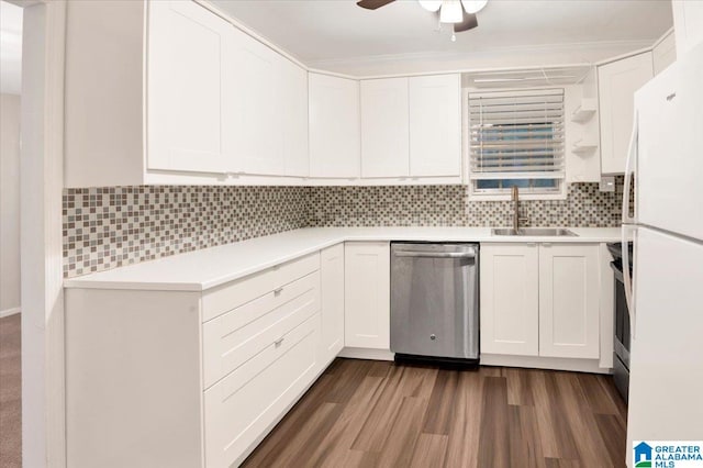 kitchen with sink, stainless steel appliances, dark hardwood / wood-style flooring, decorative backsplash, and white cabinets