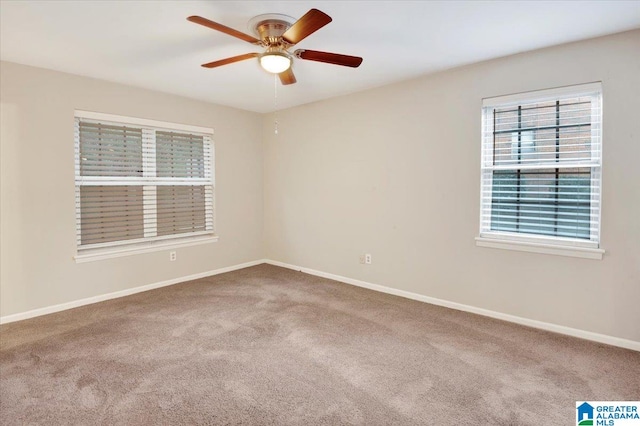 empty room featuring ceiling fan and carpet floors