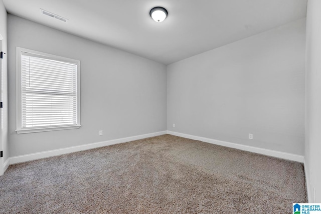 unfurnished room with carpet flooring