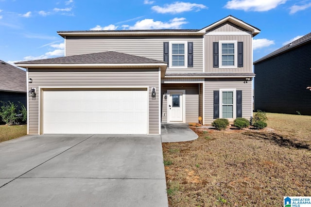 front facade featuring a garage and a front yard