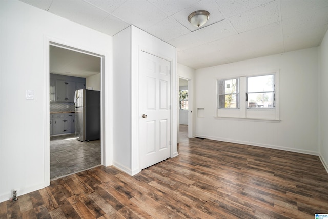 unfurnished room featuring dark hardwood / wood-style floors