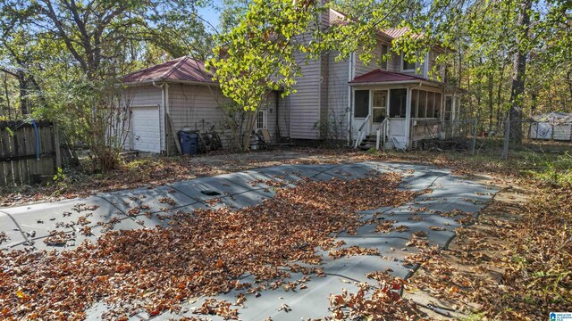 130 Big Oak Dr, Maylene, AL 35114 - rear view of house with a sunroom and fence