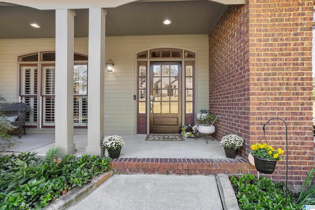 property entrance with covered porch