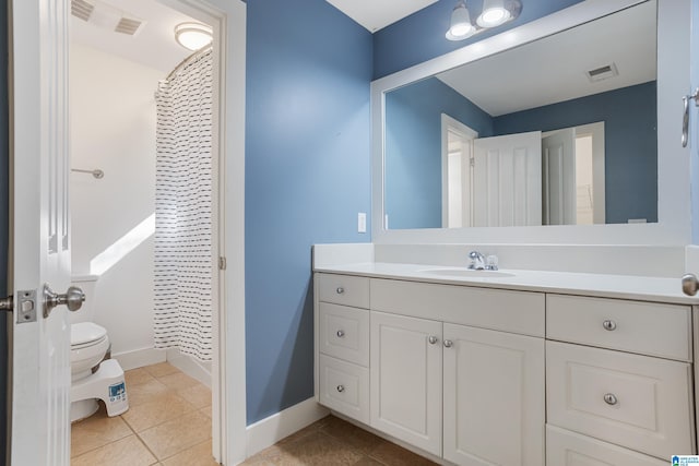 bathroom with tile patterned floors, vanity, a shower with shower curtain, and toilet