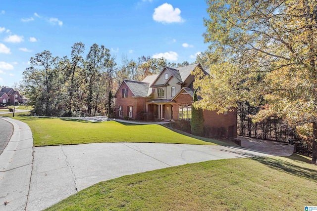 tudor house featuring a front yard