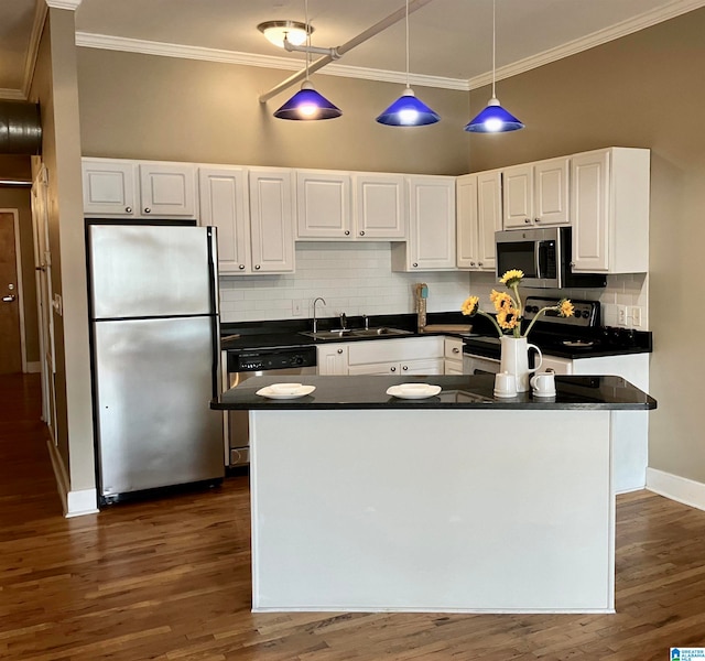 kitchen with backsplash, sink, white cabinets, and stainless steel appliances