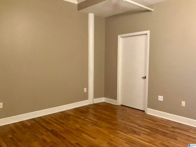 unfurnished room with hardwood / wood-style floors and ornamental molding