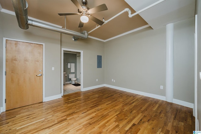 2416 1st Ave Unit 10, Birmingham, AL 35203 - empty room with a ceiling fan, electric panel, wood finished floors, and baseboards