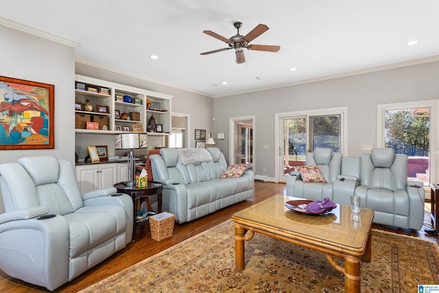 living room with ceiling fan, wood-type flooring, and ornamental molding