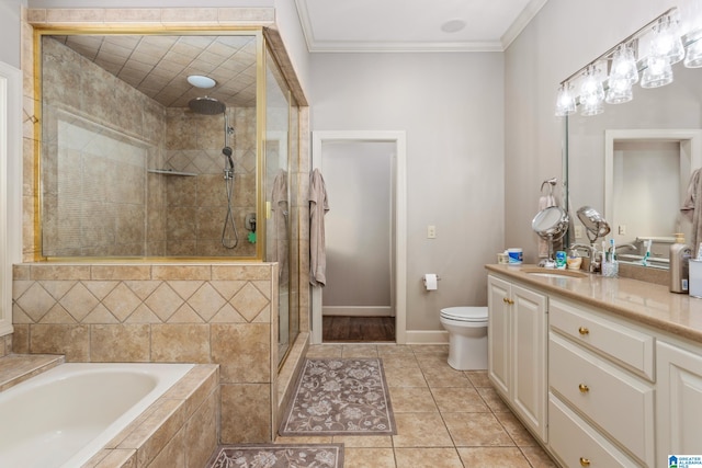 full bathroom with tile patterned flooring, separate shower and tub, crown molding, toilet, and vanity