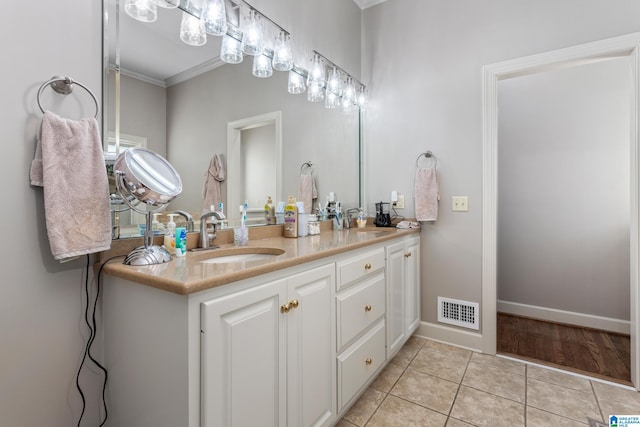 bathroom featuring tile patterned floors, vanity, and ornamental molding