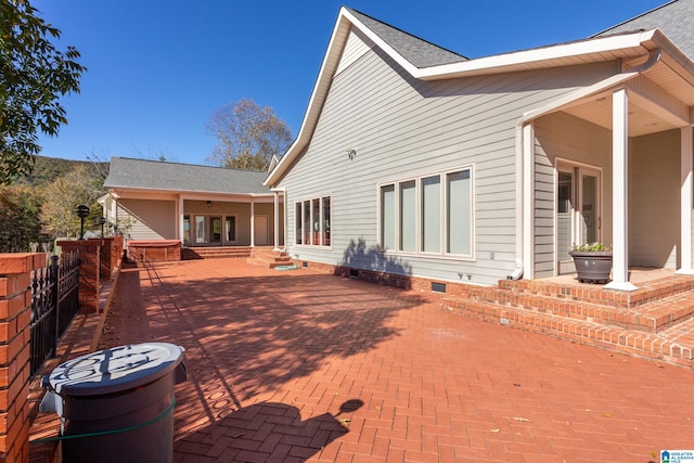 back of property with a patio area