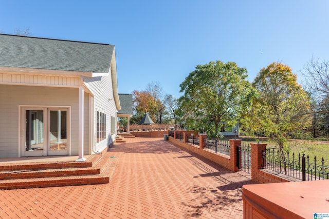 wooden deck with a patio