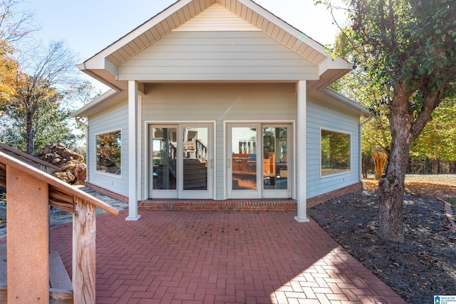 rear view of property featuring a patio