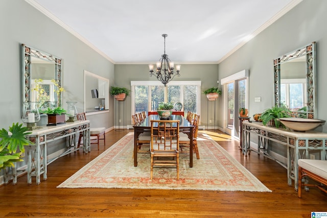 dining space featuring crown molding, dark hardwood / wood-style floors, and a notable chandelier