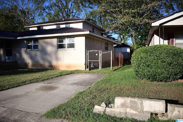 view of property exterior with a lawn