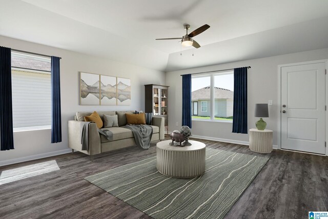 living room with vaulted ceiling, ceiling fan, and dark wood-type flooring