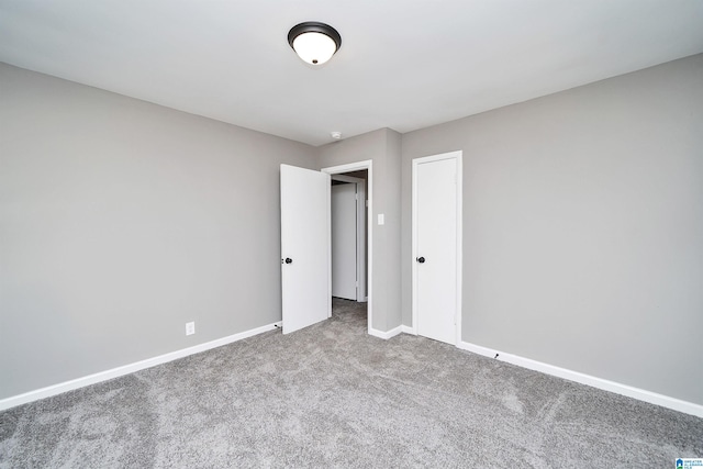 empty room with carpet flooring