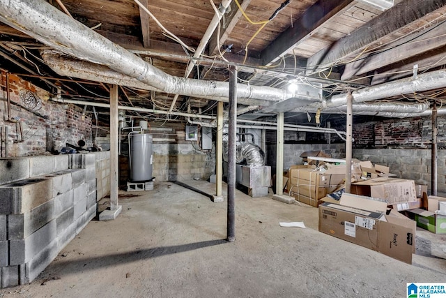 basement with electric panel and water heater