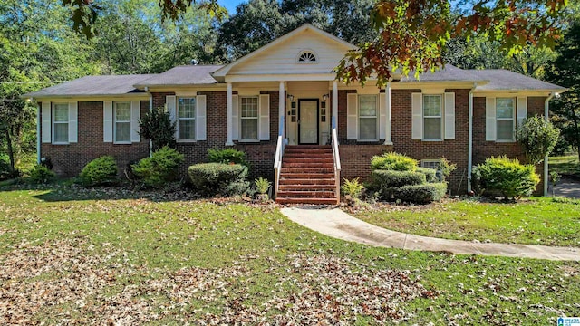 view of front of home featuring covered porch and a front lawn