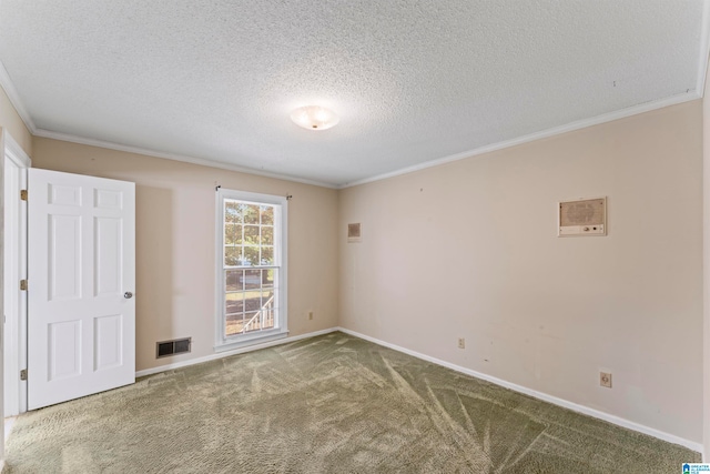 spare room featuring carpet floors, a textured ceiling, and ornamental molding