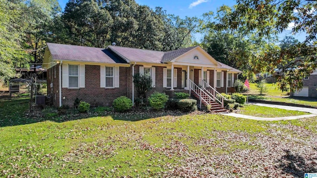 view of front of property with central AC, a porch, and a front yard