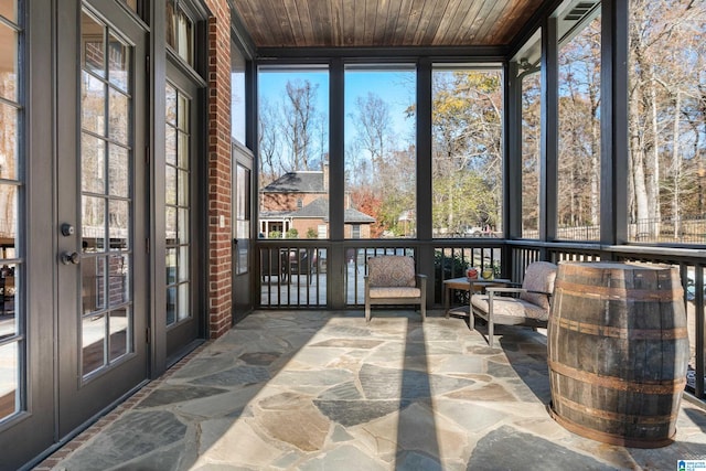 sunroom / solarium featuring wooden ceiling