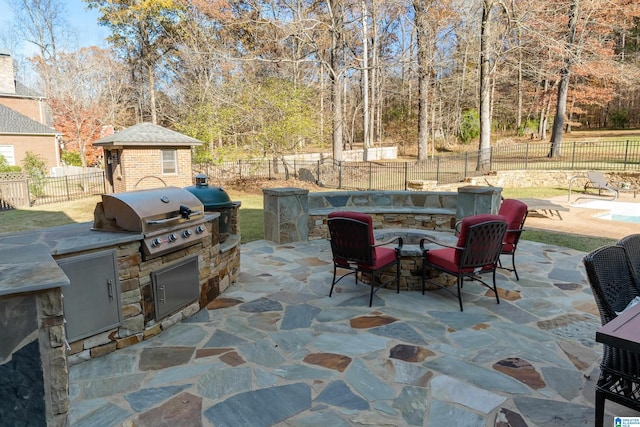 view of patio / terrace with area for grilling and a grill