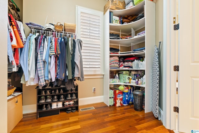 walk in closet featuring hardwood / wood-style flooring