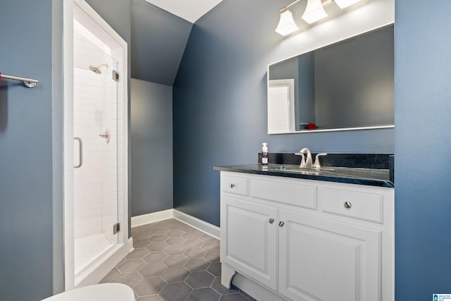 bathroom featuring tile patterned floors, lofted ceiling, a shower with door, and vanity