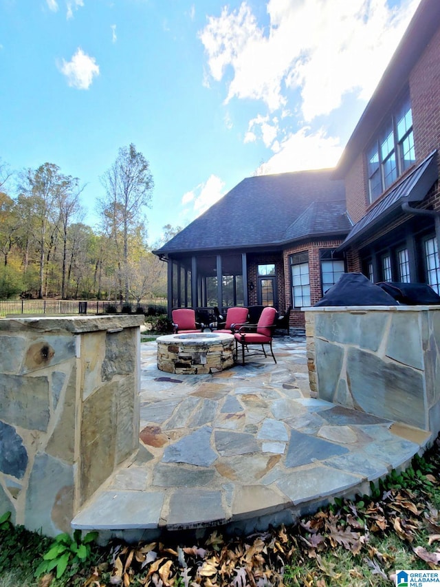 view of patio / terrace with a fire pit