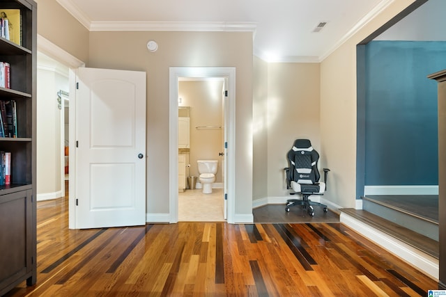 office space with crown molding and dark wood-type flooring