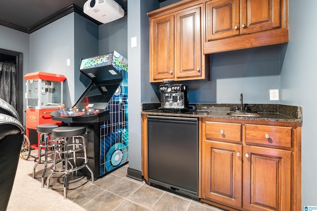 kitchen featuring black fridge, crown molding, sink, dark stone countertops, and light tile patterned floors