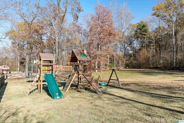 view of playground with a lawn and a trampoline