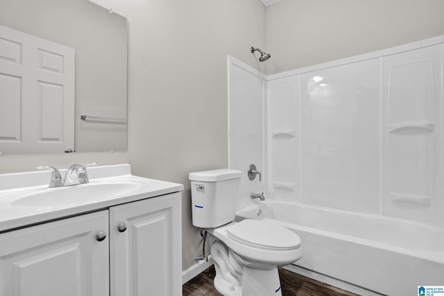 full bathroom with vanity, toilet, wood-type flooring, and shower / washtub combination