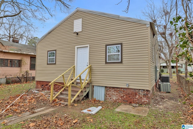 back of property featuring central AC unit