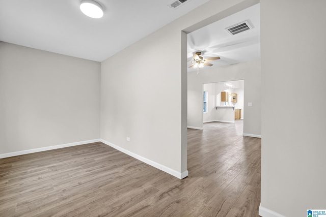 unfurnished room featuring hardwood / wood-style flooring and ceiling fan