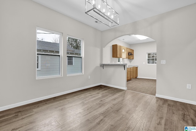 unfurnished living room featuring hardwood / wood-style floors