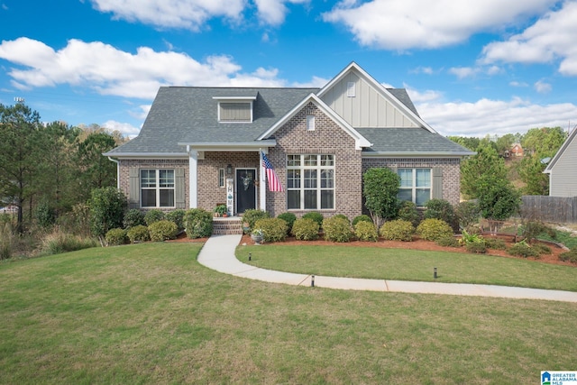 craftsman-style home featuring a front yard