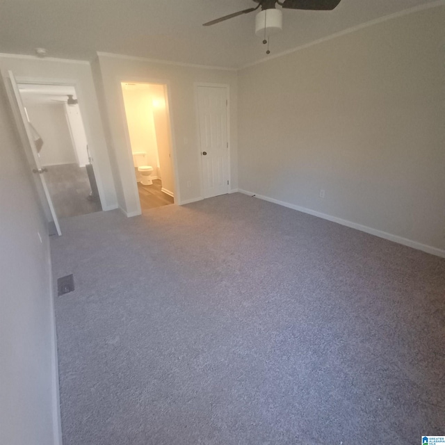 unfurnished bedroom featuring connected bathroom, ceiling fan, and carpet floors