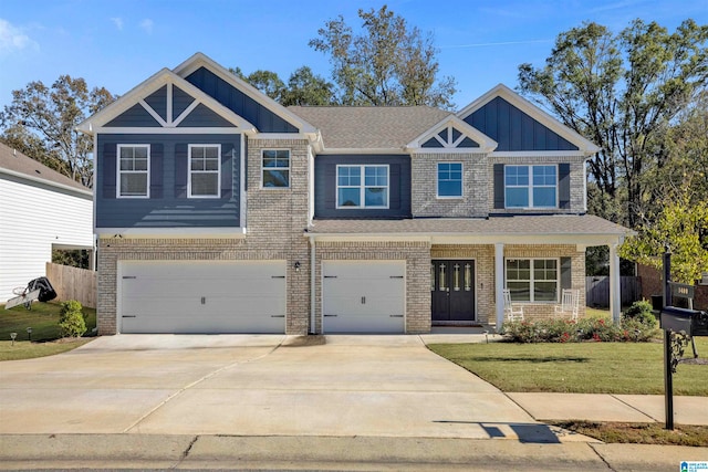 craftsman-style house with a front yard and a garage