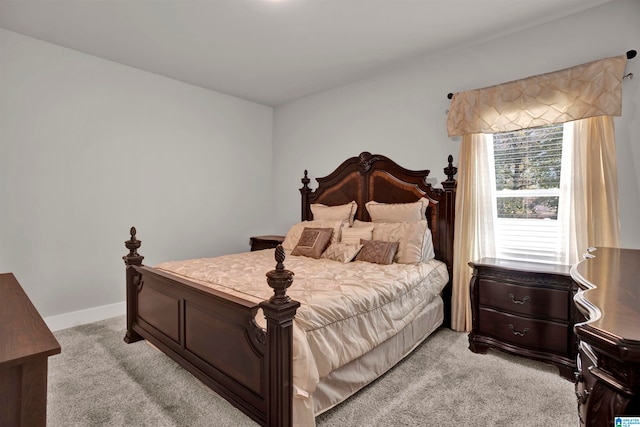 bedroom with light colored carpet