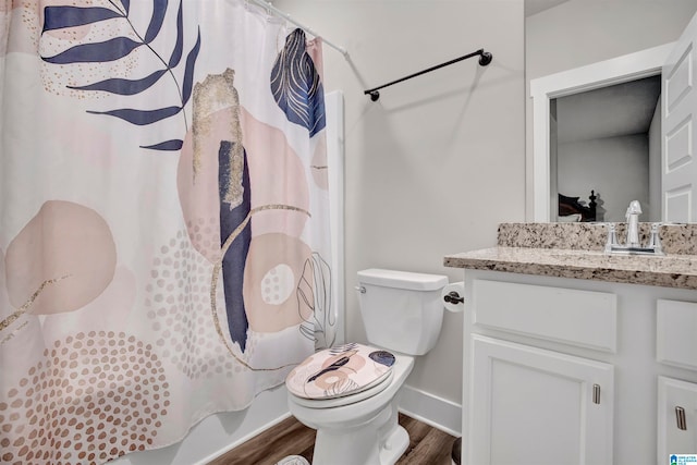 bathroom with a shower with curtain, vanity, toilet, and wood-type flooring