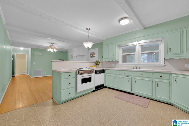 kitchen with sink, hanging light fixtures, tasteful backsplash, light hardwood / wood-style floors, and white appliances